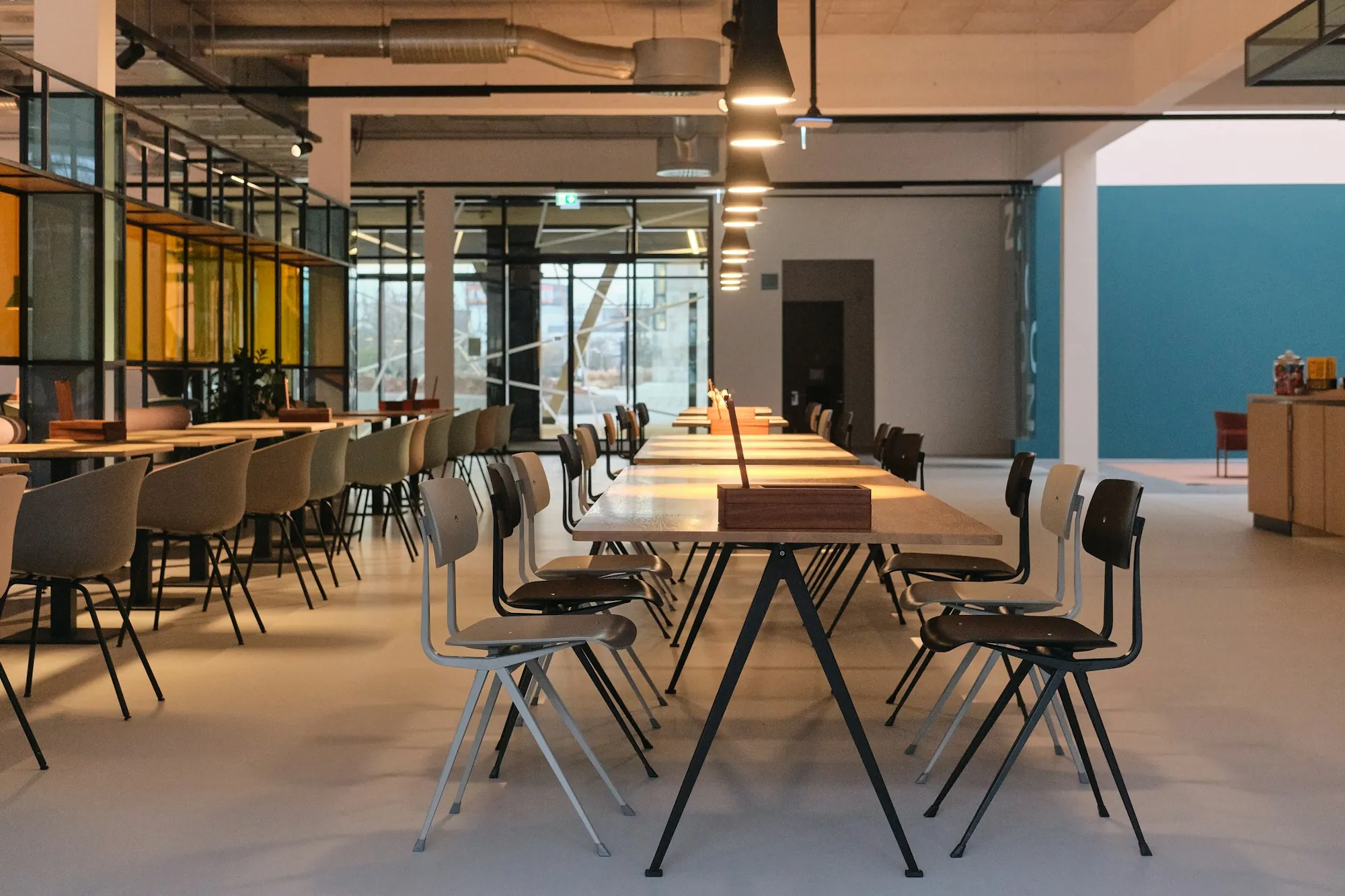 Open office with long tables and chairs
